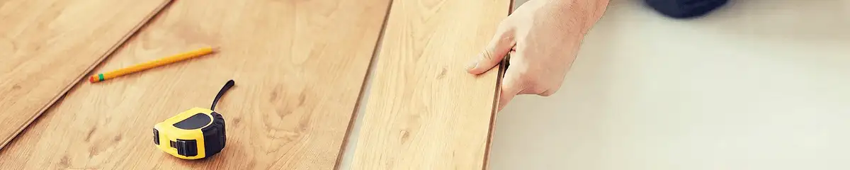 A professional installing wood flooring in Cleveland, OH
