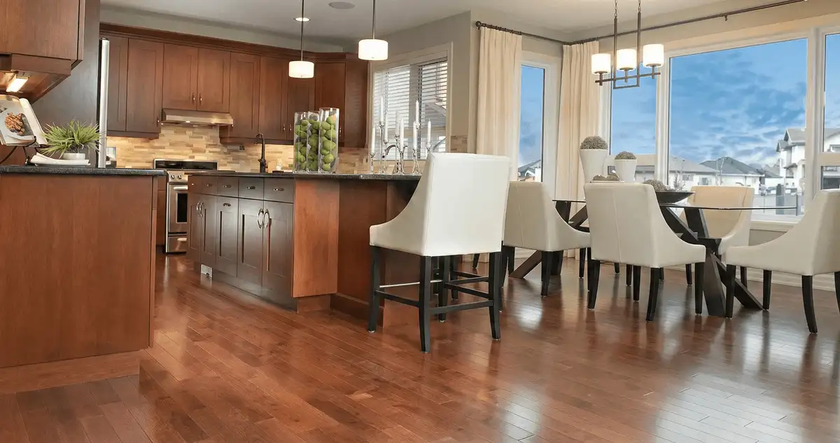 A modern kitchen with professionally installed wood flooring in Cleveland, OH
