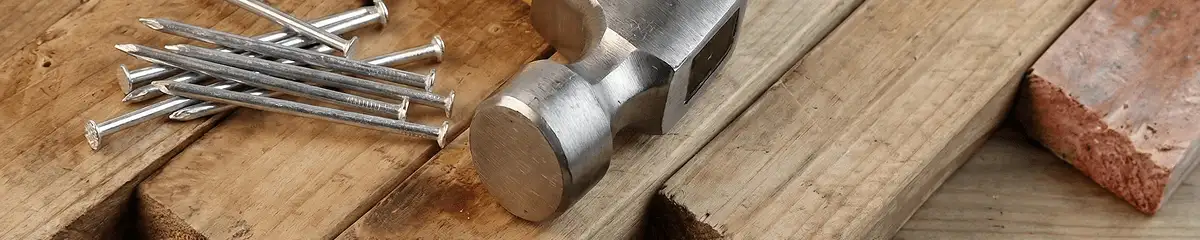 Hammer and nails on hardwood flooring boards in Cleveland, OH