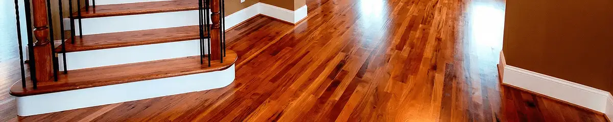 Base floor of a staircase with professionally restored wood flooring in Cleveland OH