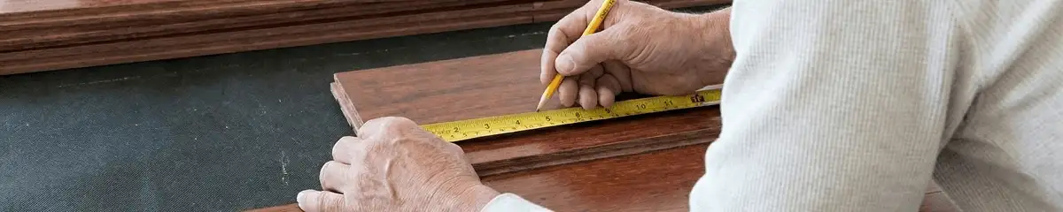 A professional installing wood flooring in Cleveland, OH